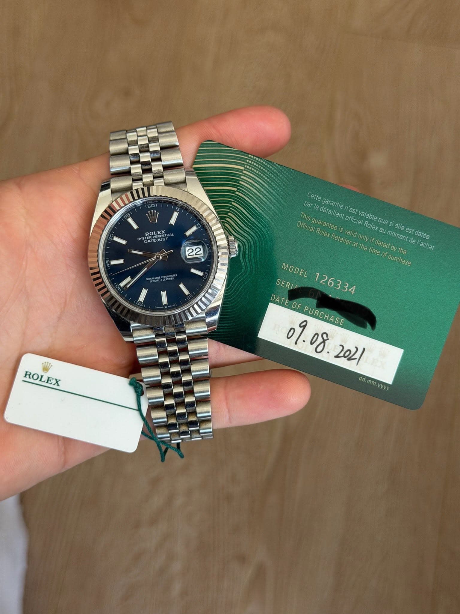 May be an image of wrist watch and text