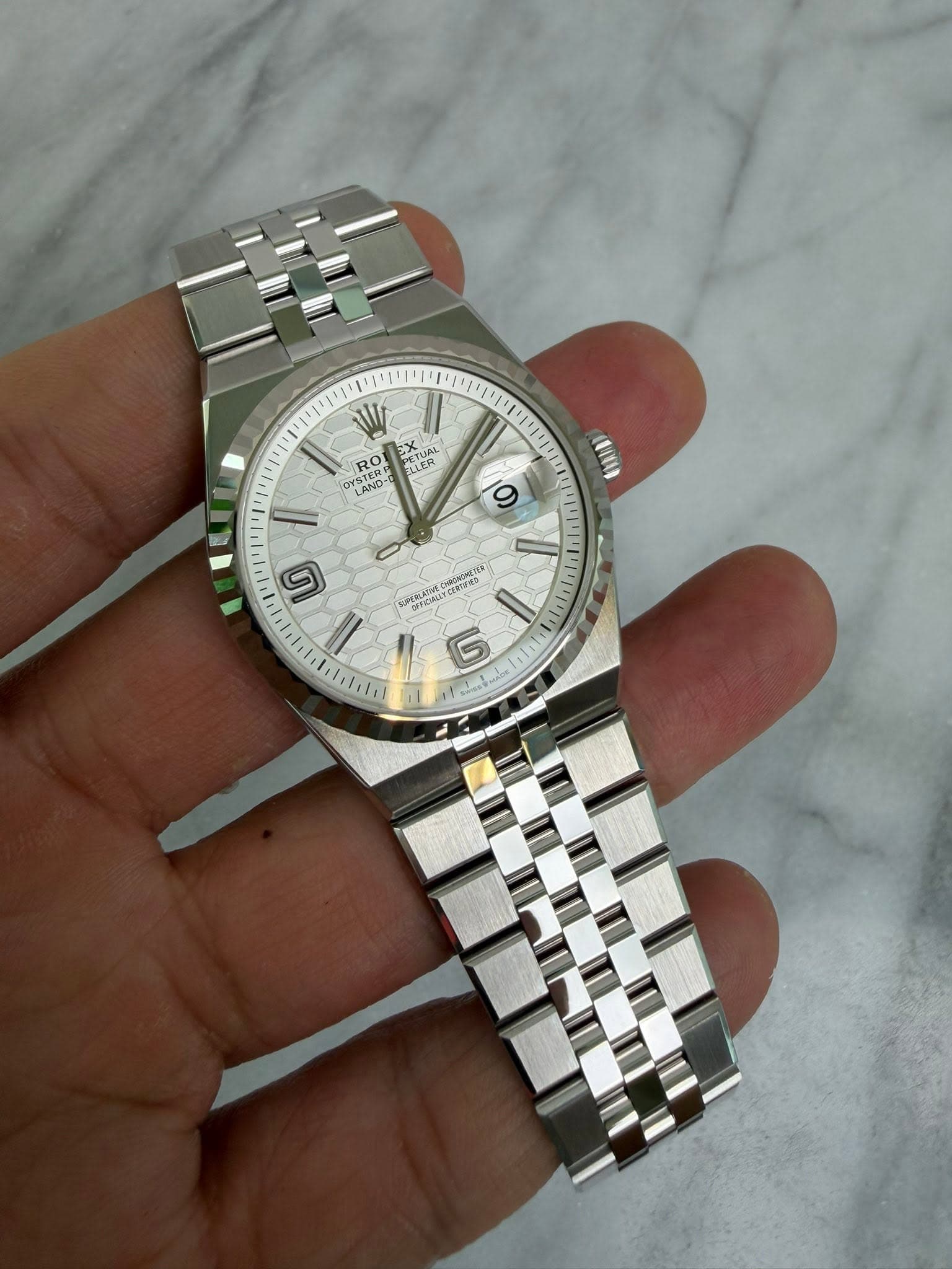 May be an image of wrist watch and text
