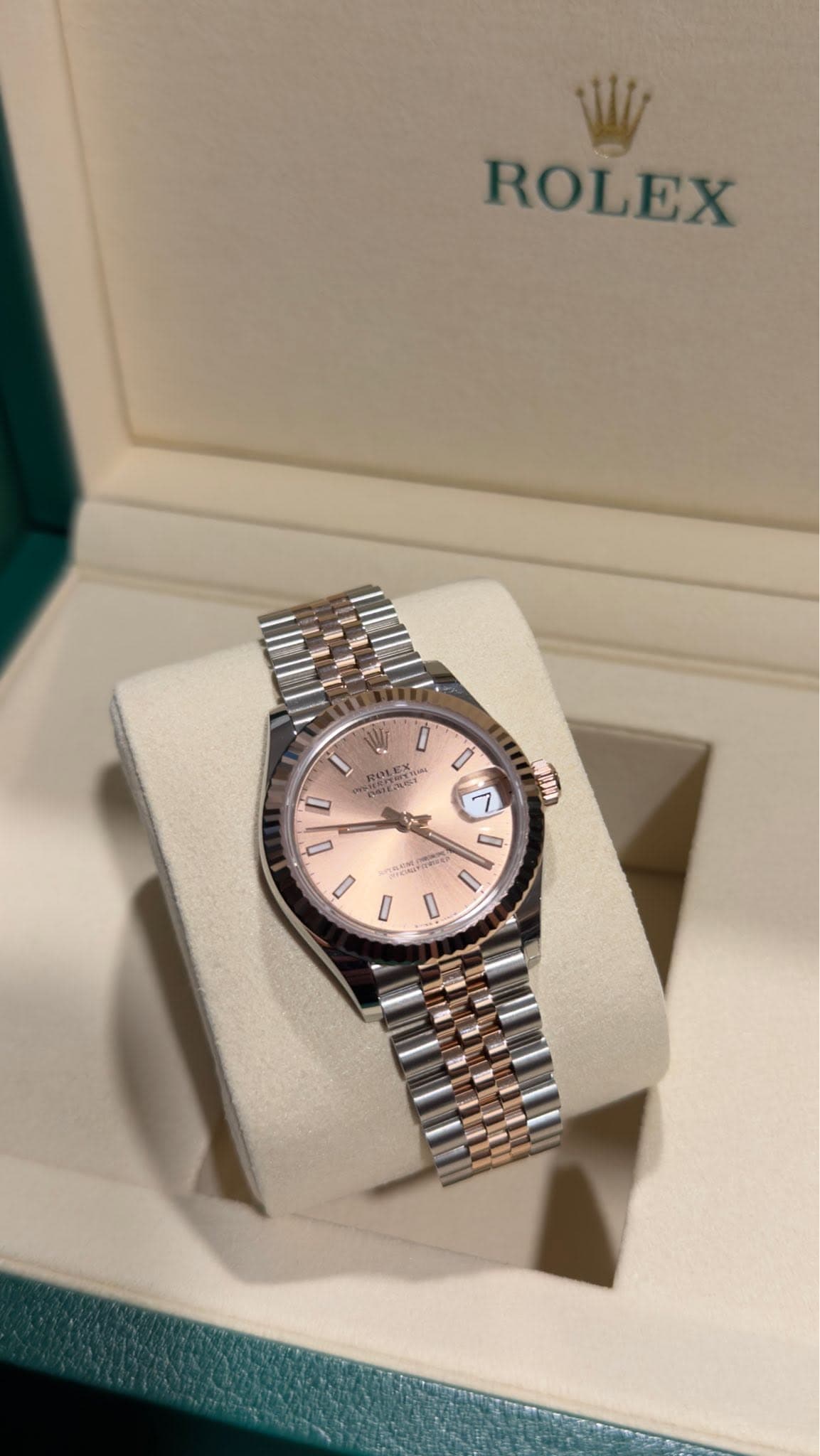 May be an image of wrist watch and text