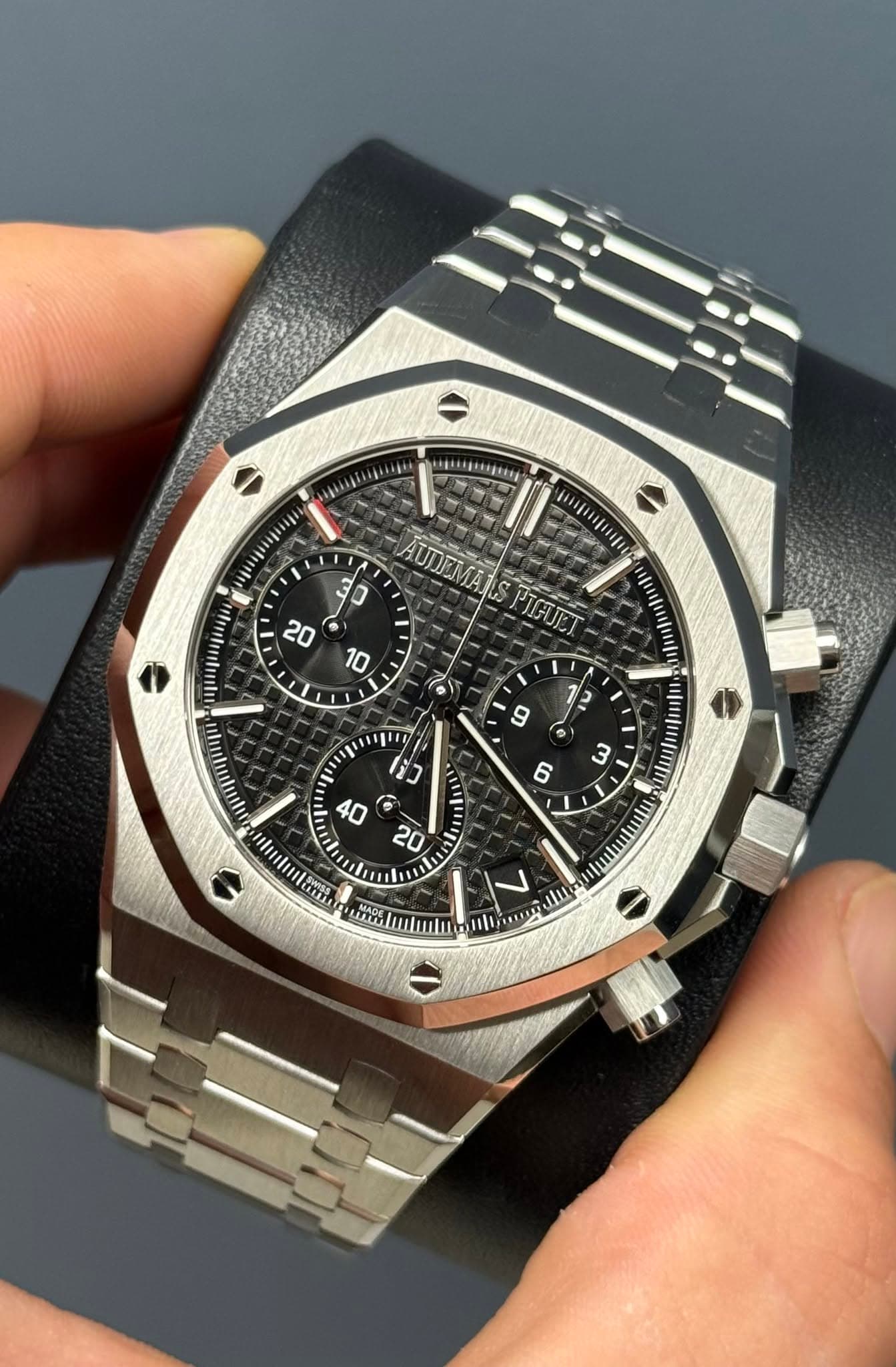 May be an image of wrist watch and text