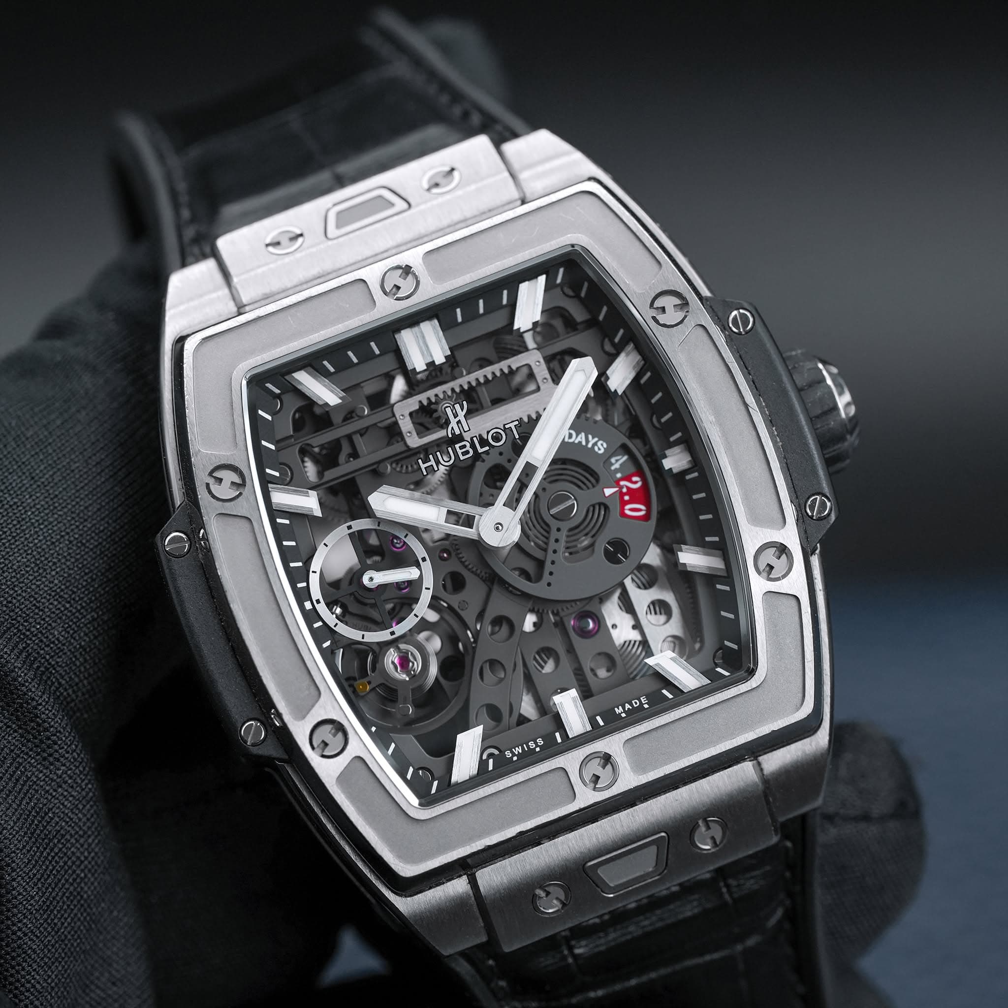 May be an image of wrist watch and text