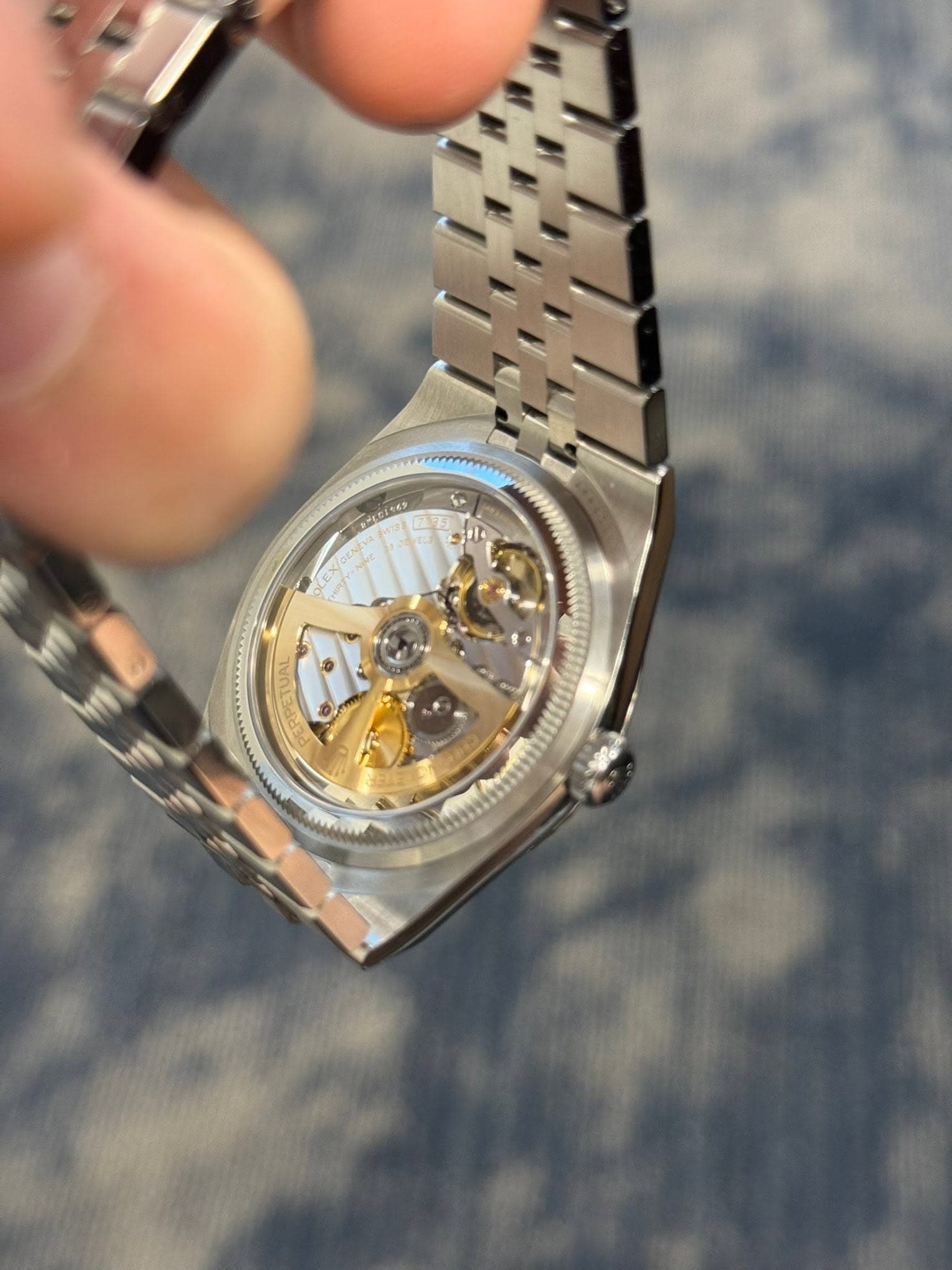 May be an image of wrist watch and text