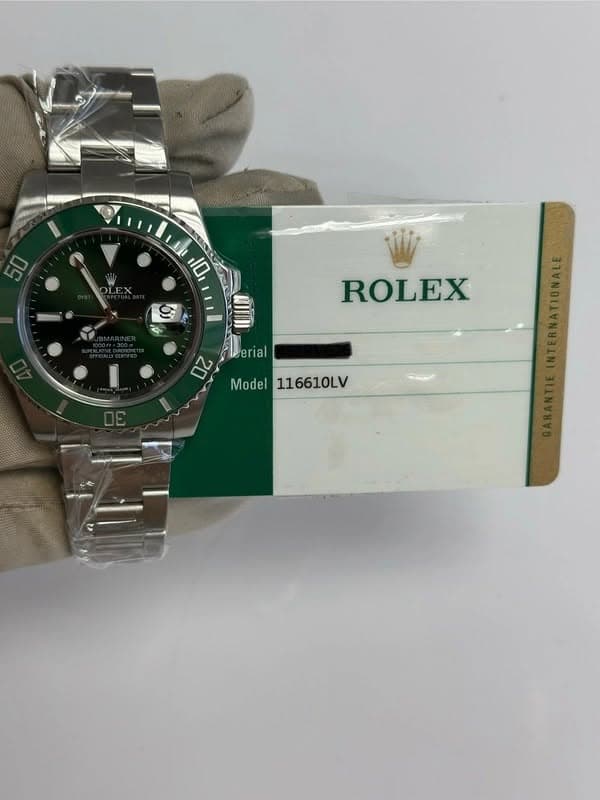 May be an image of wrist watch and text that says '50 U0 10 ROLEX erial 2 Model Model116610LV 116610LV'