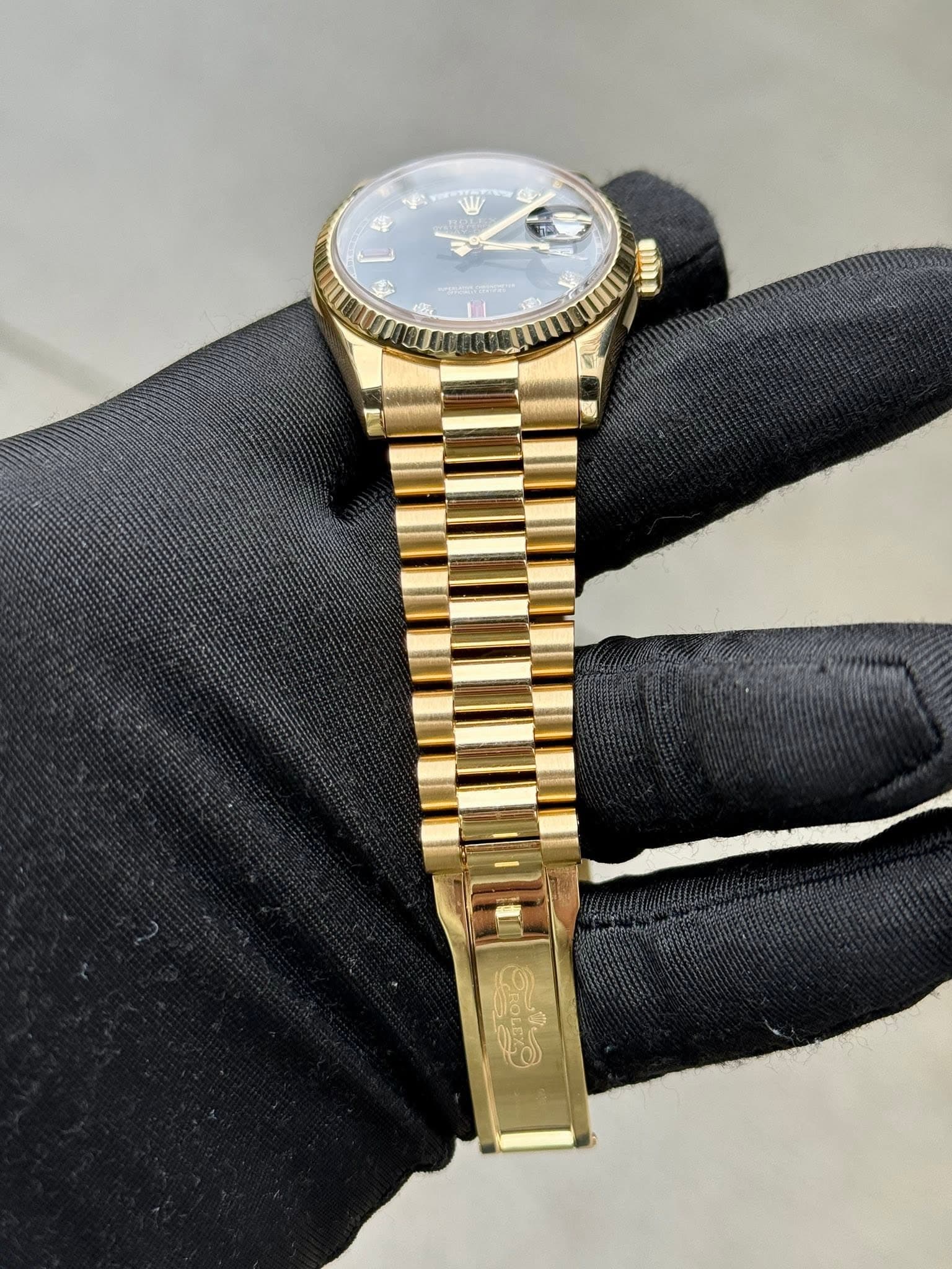 May be an image of wrist watch and text