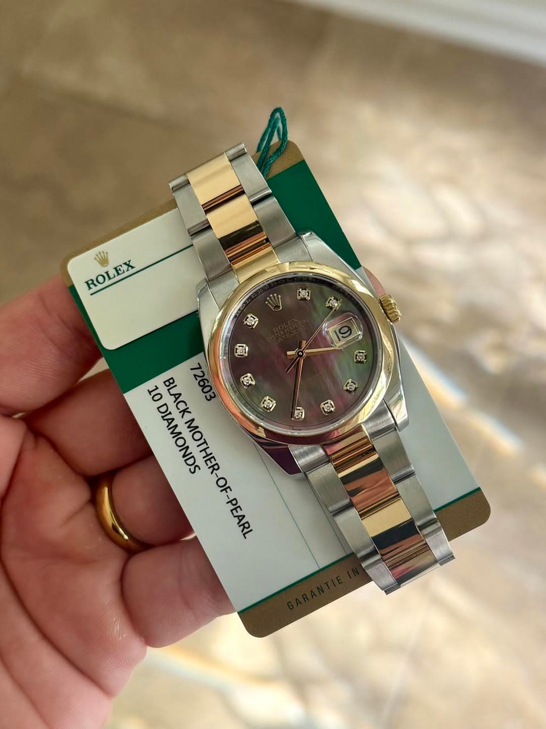 May be an image of wrist watch and text that says 'ROLEX ROLEX ROL 3X 10 ODIAMONDS BLACK BLACKMOTHER-OF-PEA 72603 DIAMONDS MOTHER-OF-PEAR'