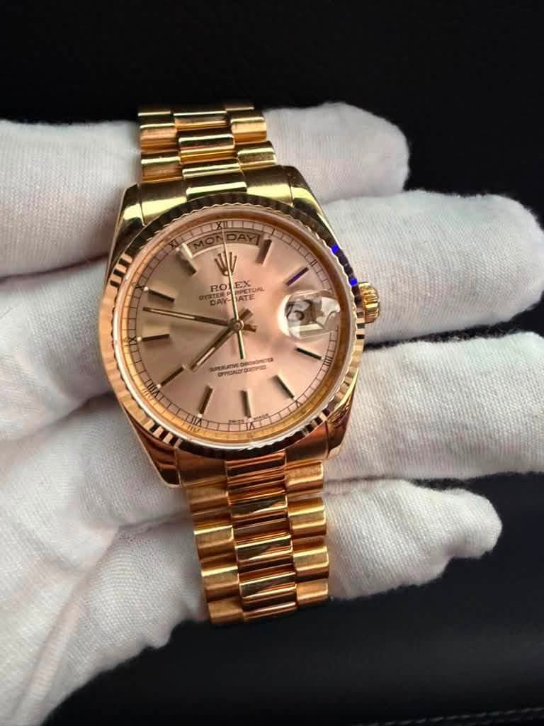May be an image of wrist watch and text
