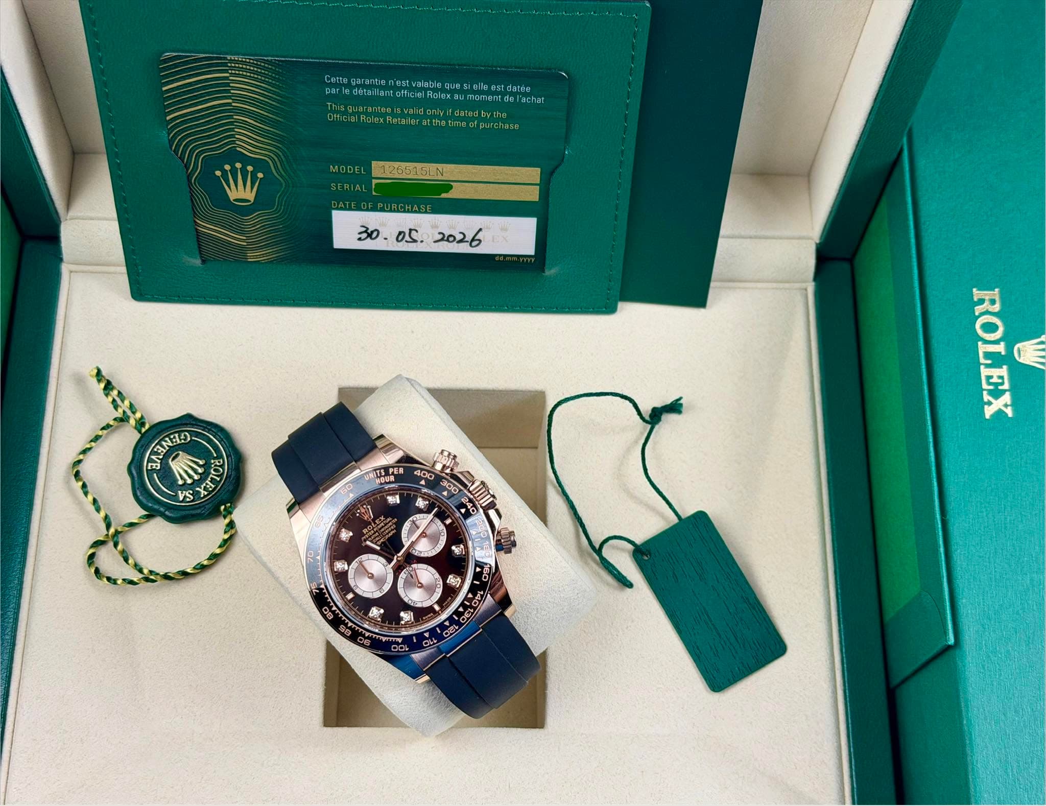 May be an image of fragrance, wrist watch and text