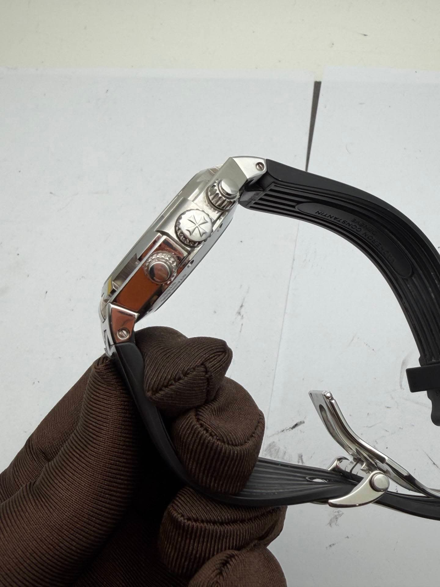 May be an image of saddle-stitched leather, wrist watch and leather
