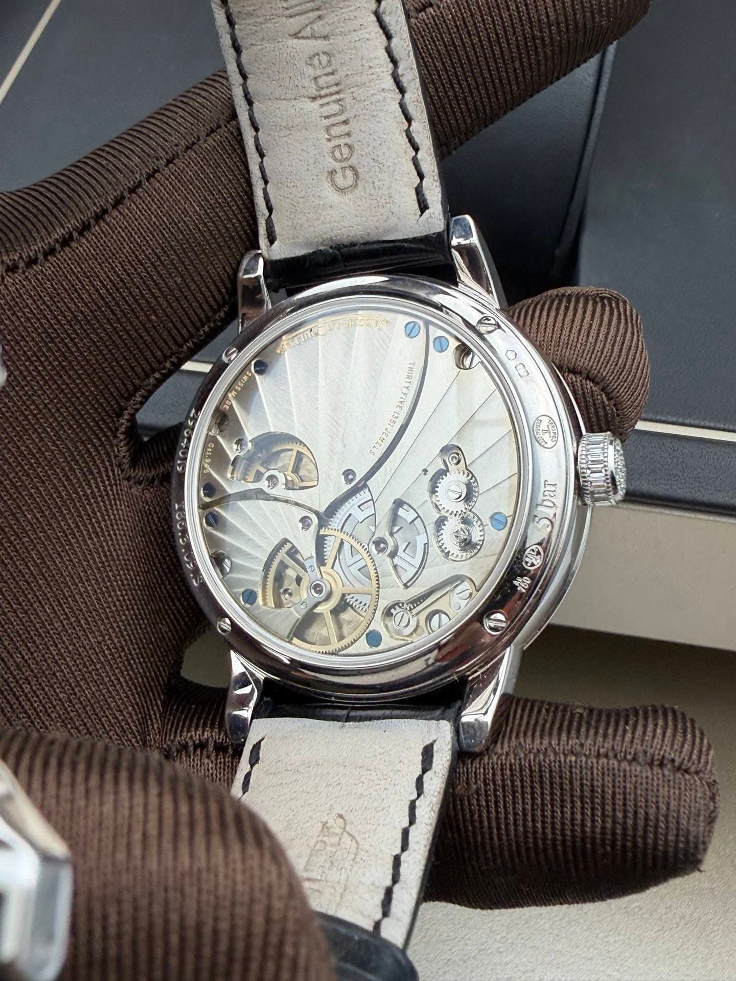 May be an image of wrist watch and text