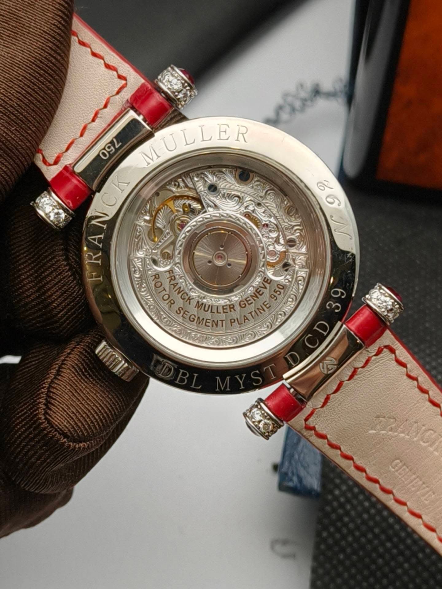 May be an image of wrist watch and text that says 'ல 9 បន 09 MULLER ULLER NCK ERA PRA -0. O TORSEGMENT ULLER 奇之 OW UMI 22411C GELTEYE'