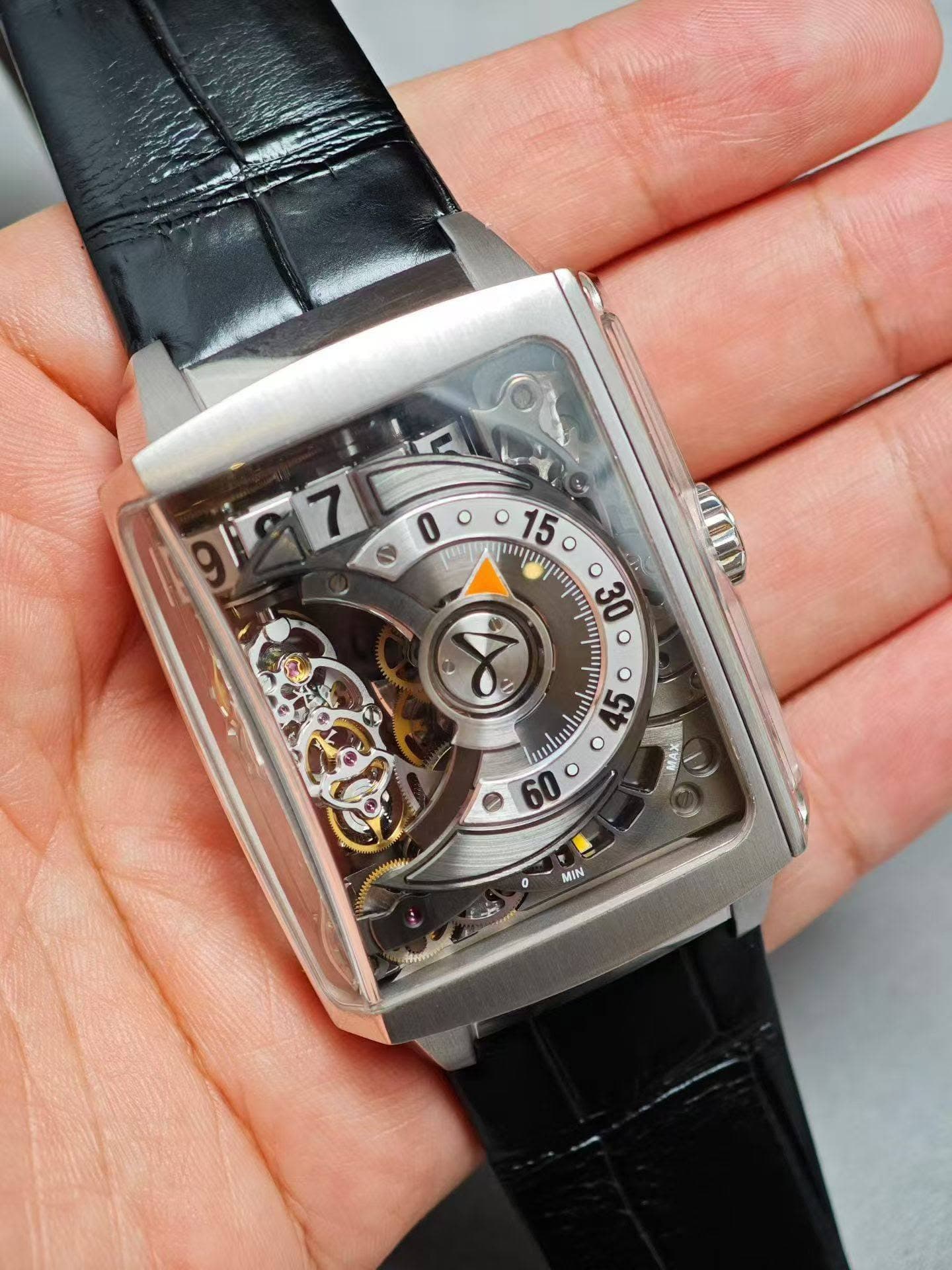 May be an image of wrist watch and text