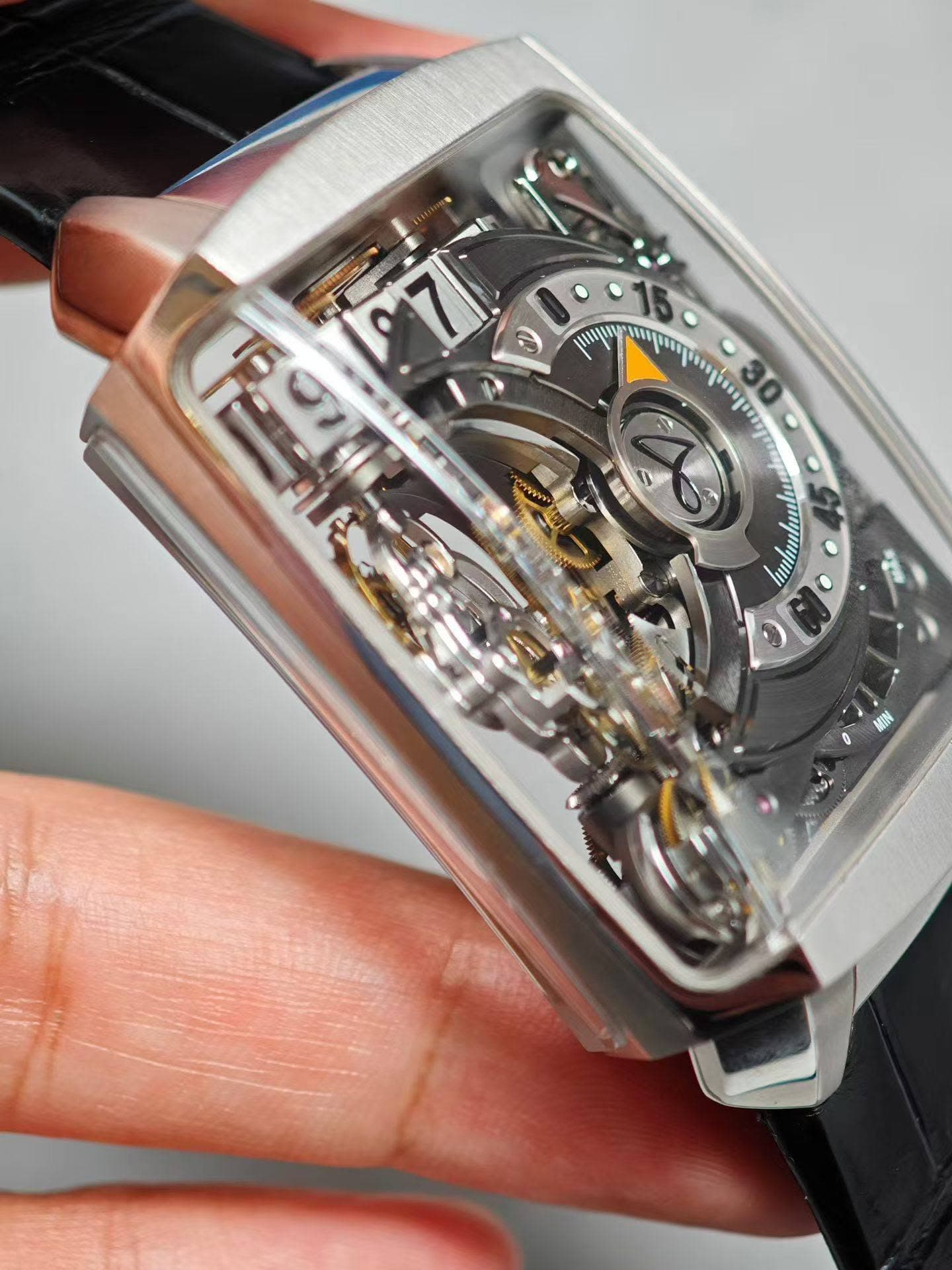 May be an image of wrist watch and text