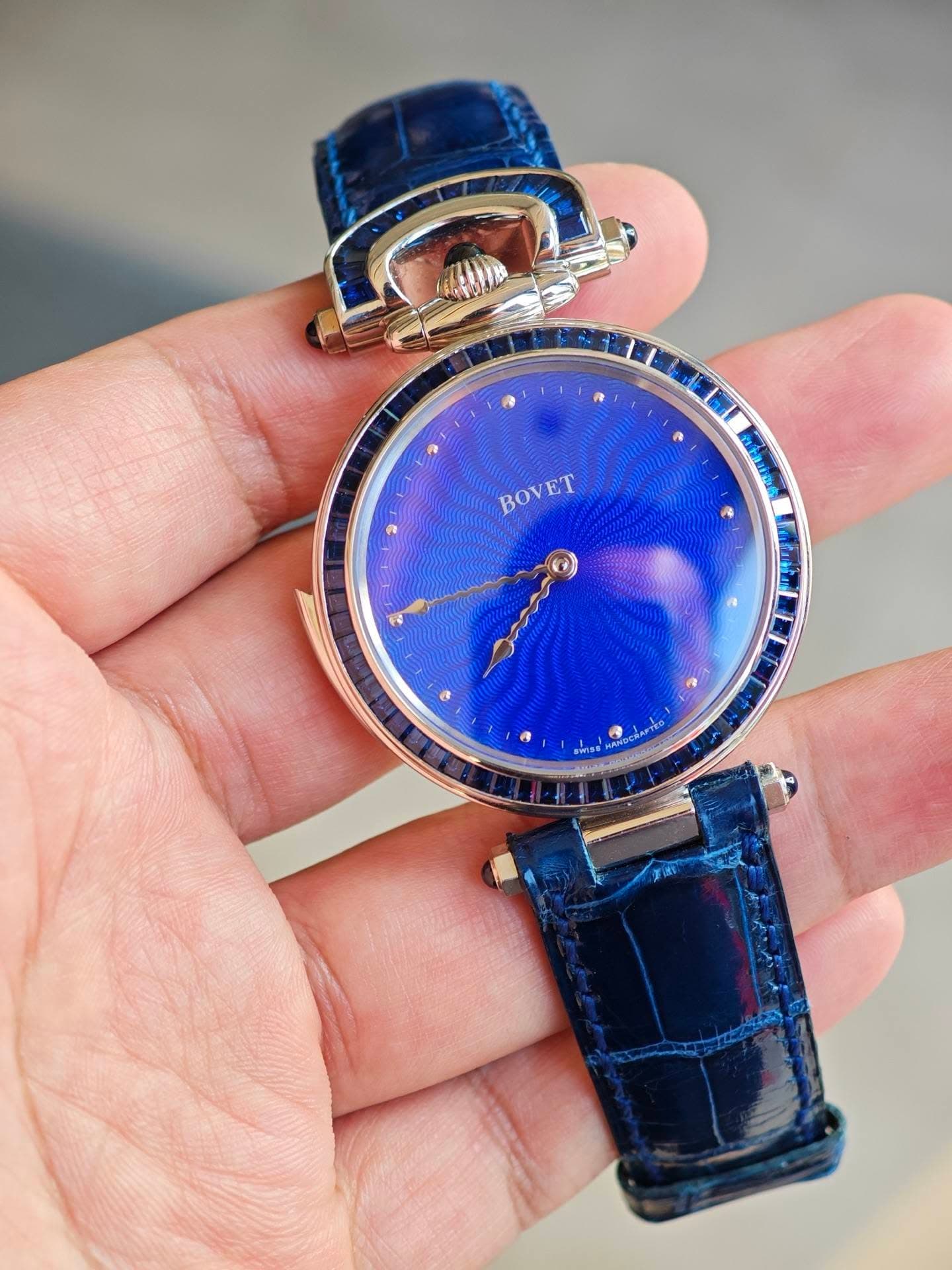 May be an image of wrist watch and text