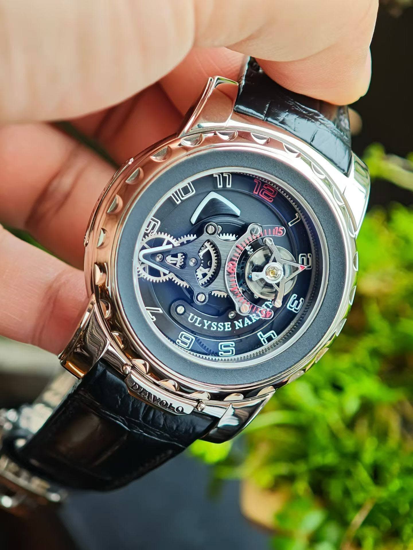 May be an image of wrist watch and text