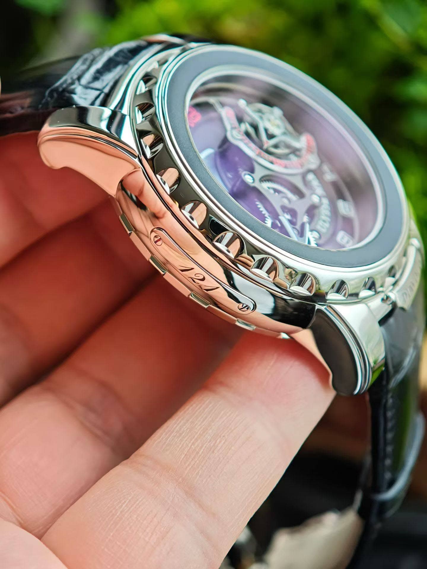 May be an image of wrist watch and text