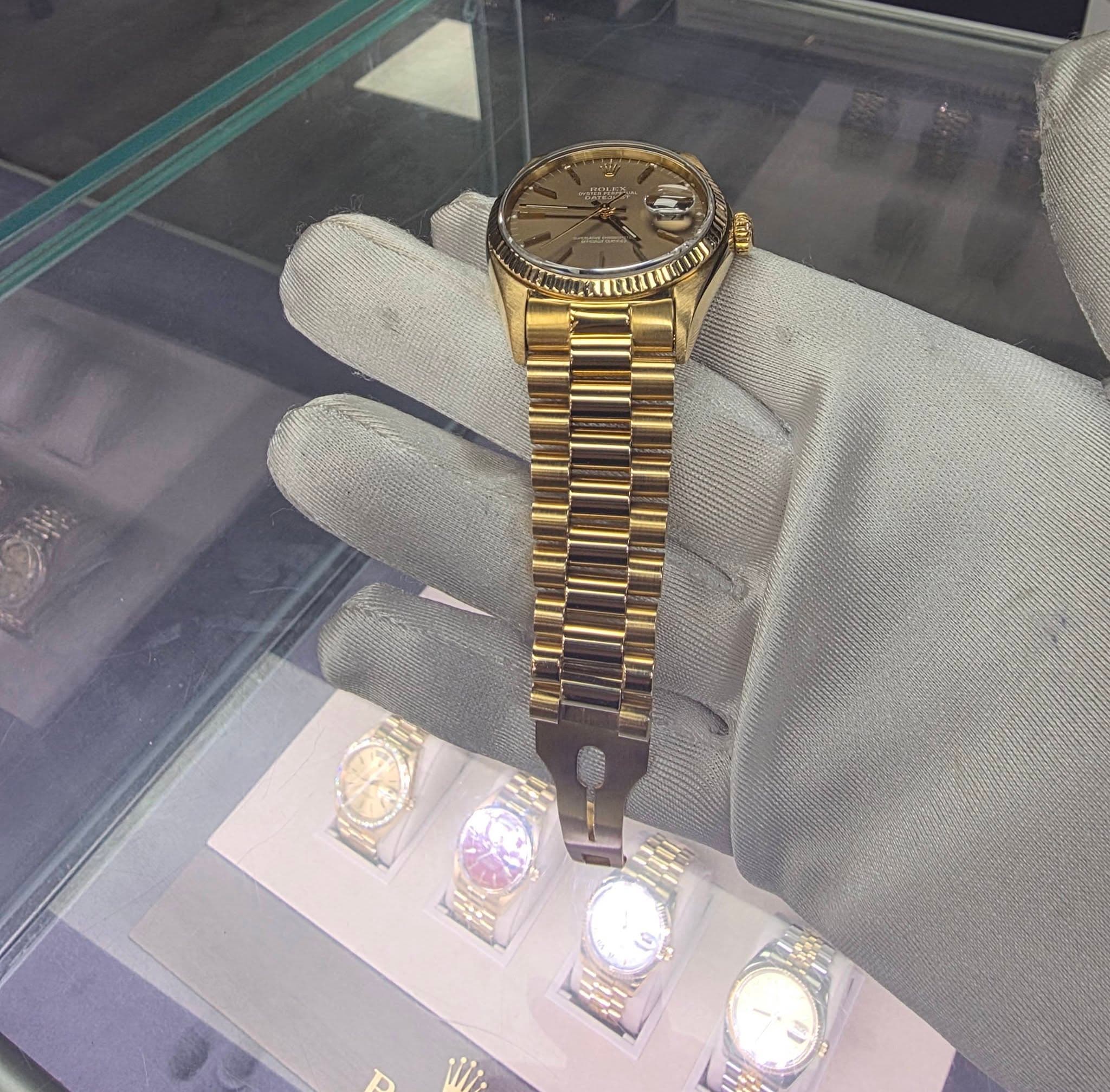 May be an image of wrist watch and text