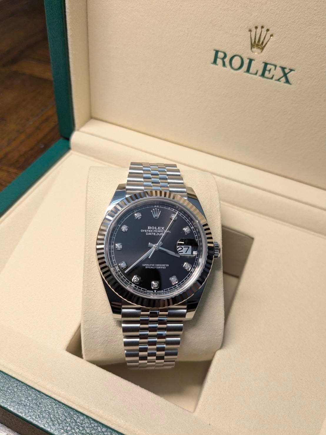 May be an image of wrist watch and text