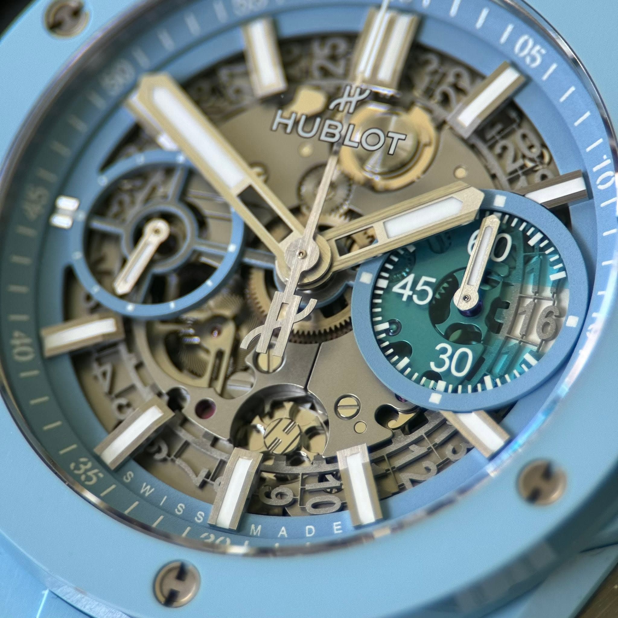 May be an image of wrist watch and text that says '105 05 ม HUBLOT ጥገ MA W // ምዮ SWISS S S ク0ー MADE M A D E'