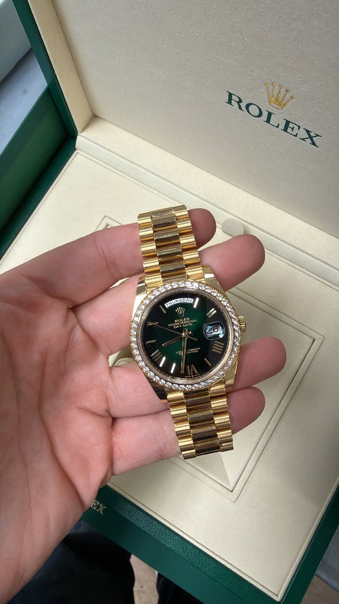 May be an image of wrist watch and text