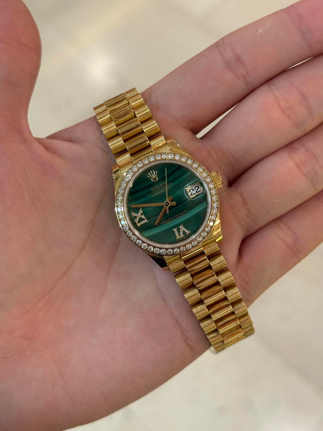 May be an image of wrist watch and text