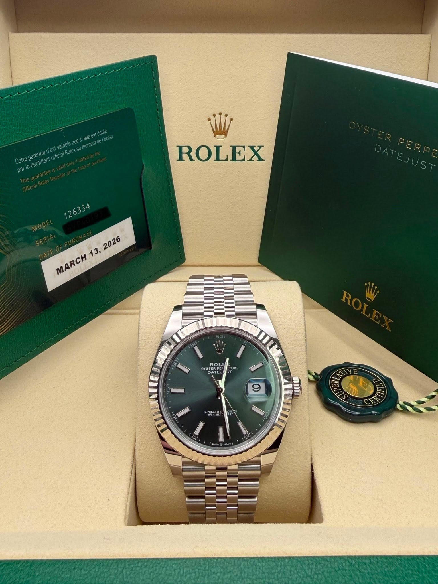 May be an image of wrist watch and text that says 'ROLEX , MARCH ROLI 김 9 9 mI'
