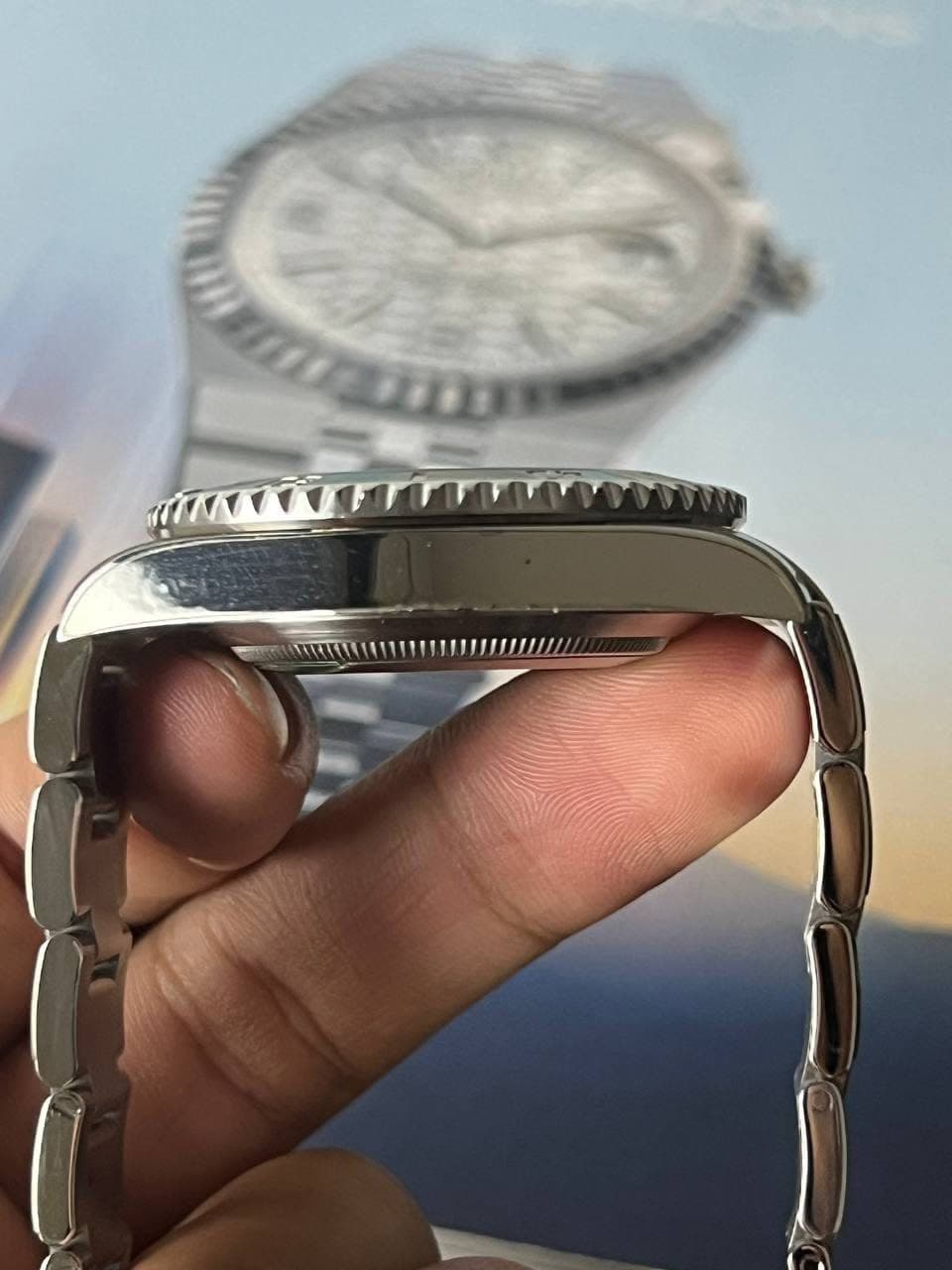 May be an image of wrist watch and text