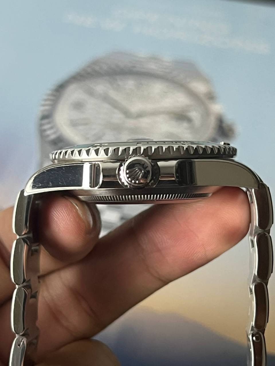 May be an image of wrist watch and text