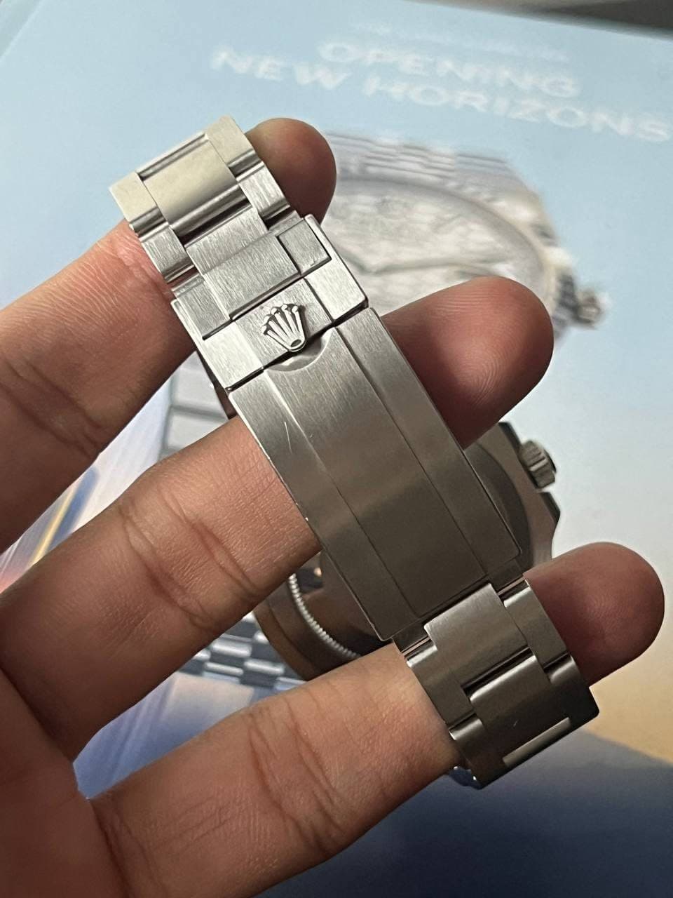 May be an image of wrist watch and text that says 'W'