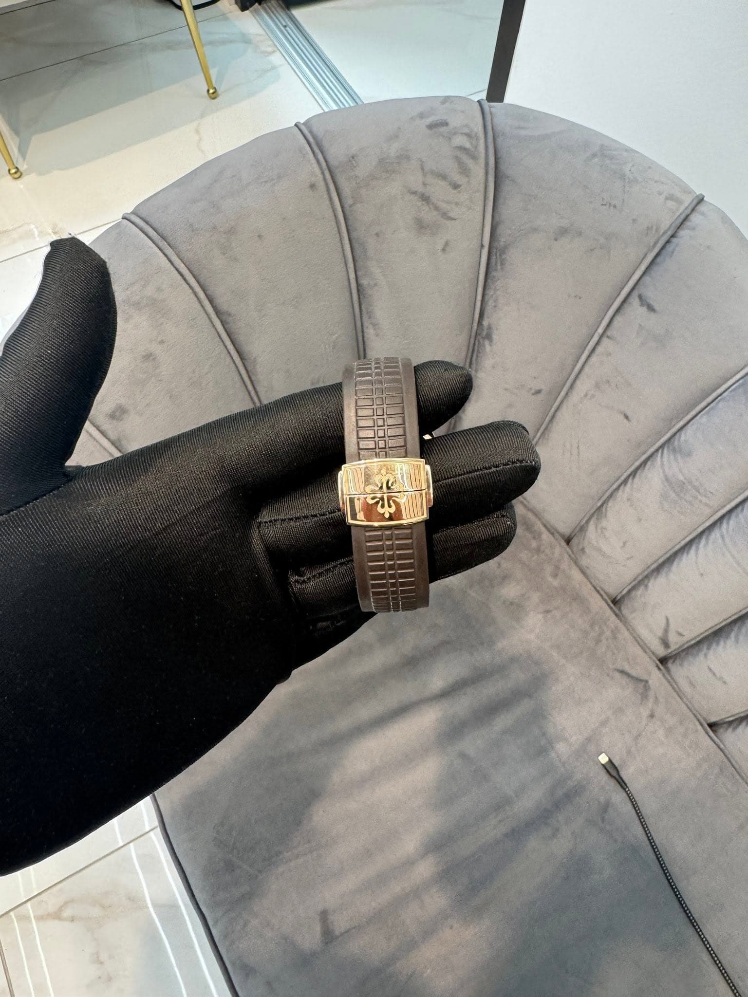 May be an image of wrist watch and leather