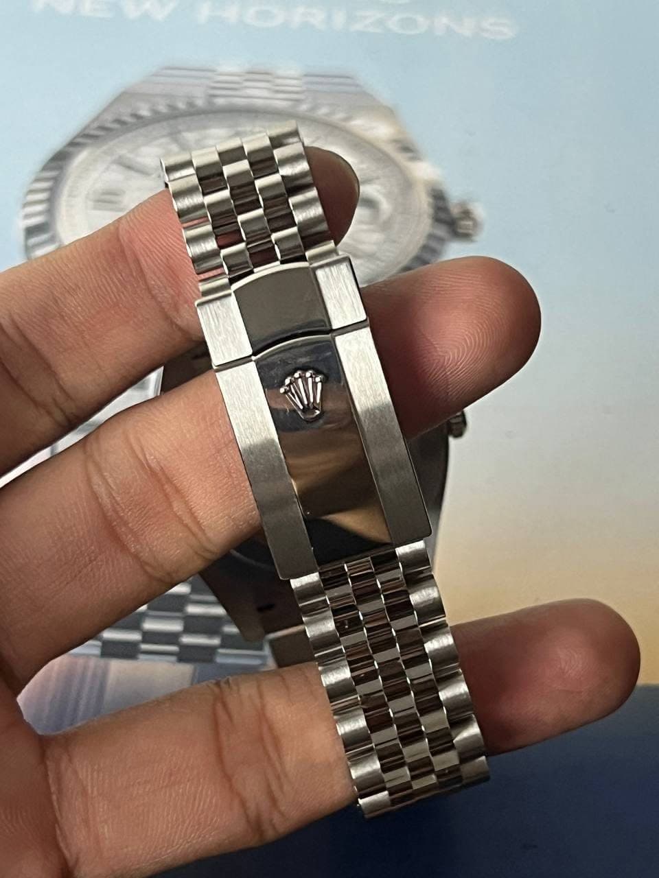 May be an image of wrist watch and text