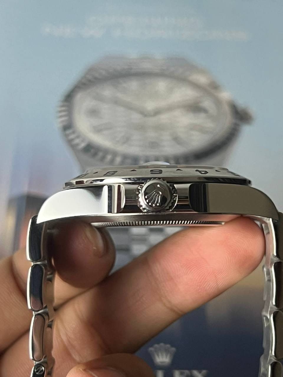 May be an image of wrist watch and text