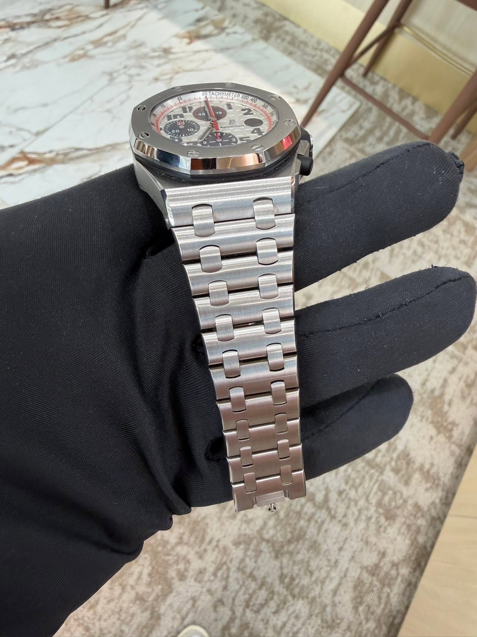 May be an image of wrist watch and text