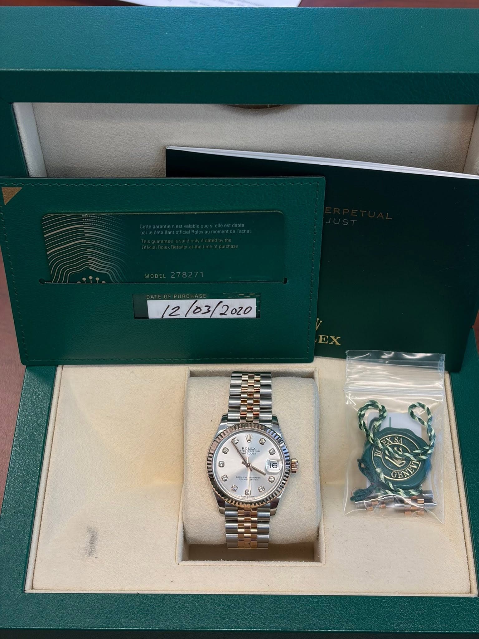 May be an image of wrist watch and text that says '12/03/ ® و 4 e O M 1 ® D 9 $ R ባጌ 16 6 Ci D D ® D و GEN'