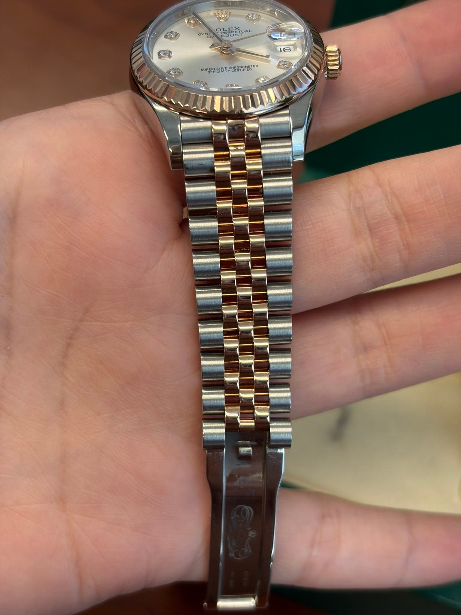 May be an image of wrist watch and text
