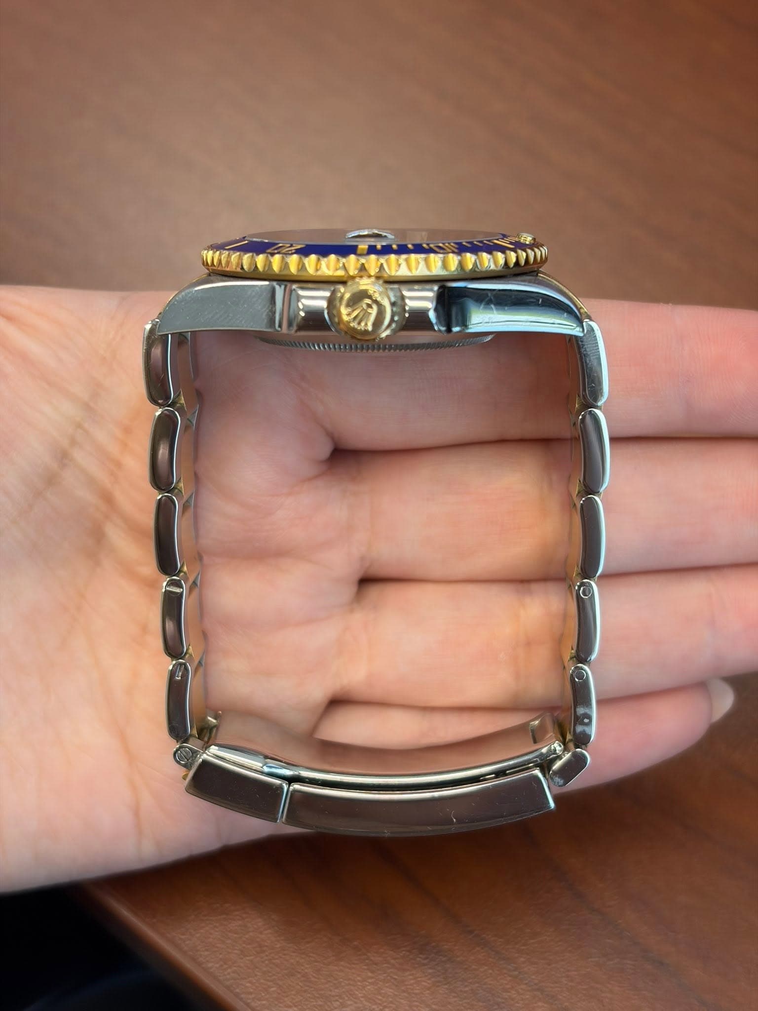 May be an image of wrist watch and text