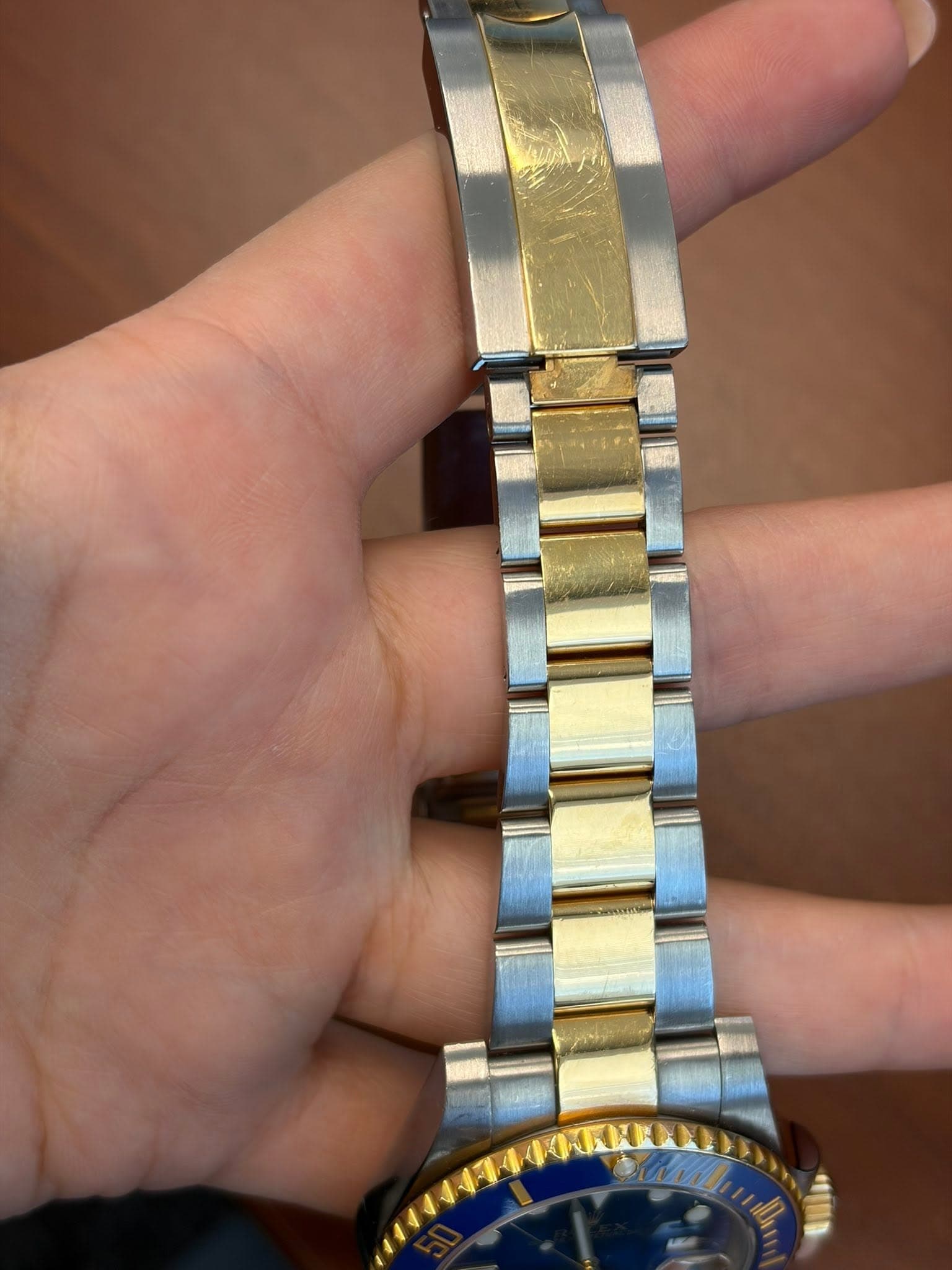 May be an image of wrist watch and text