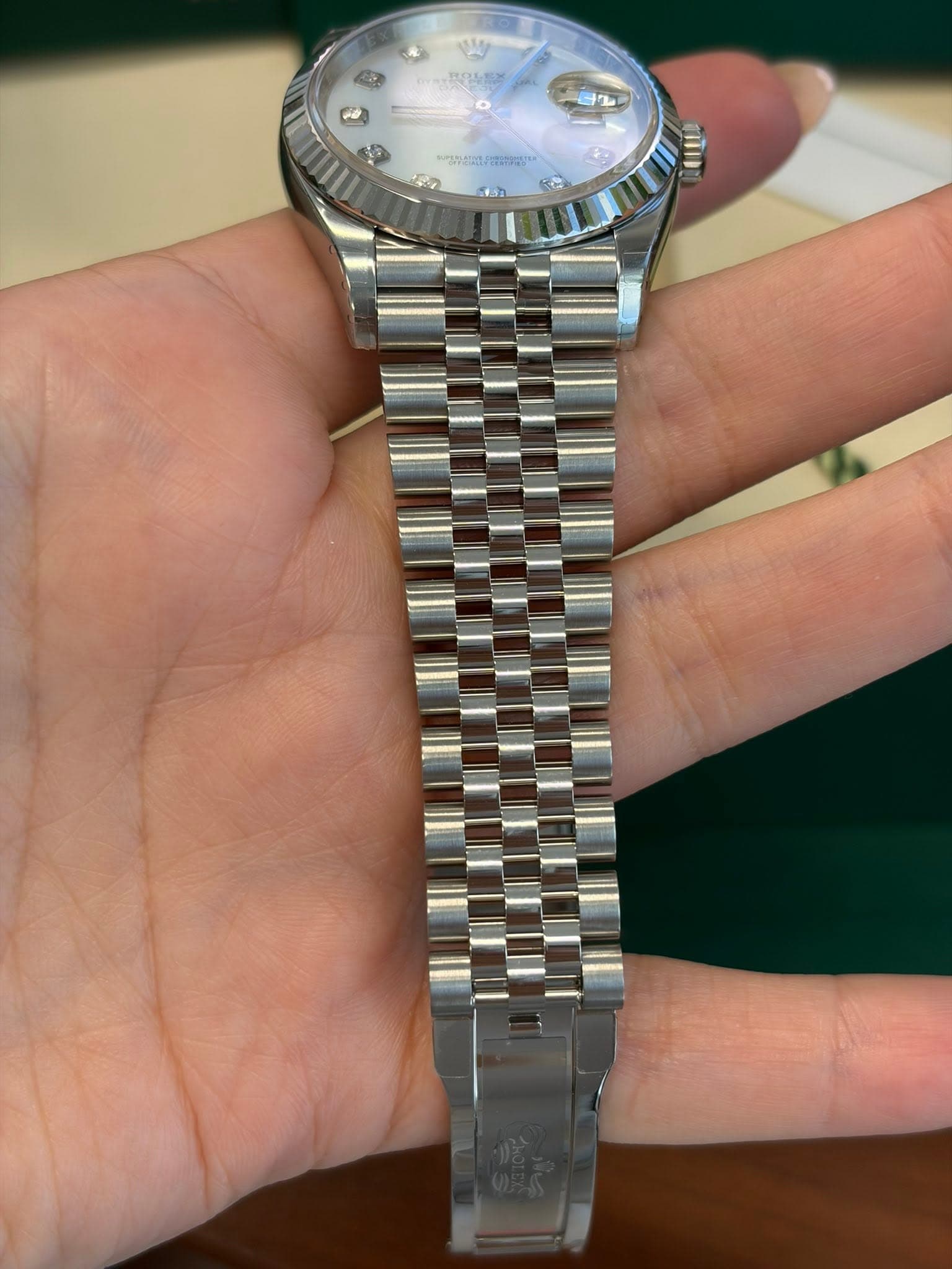 May be an image of wrist watch and text