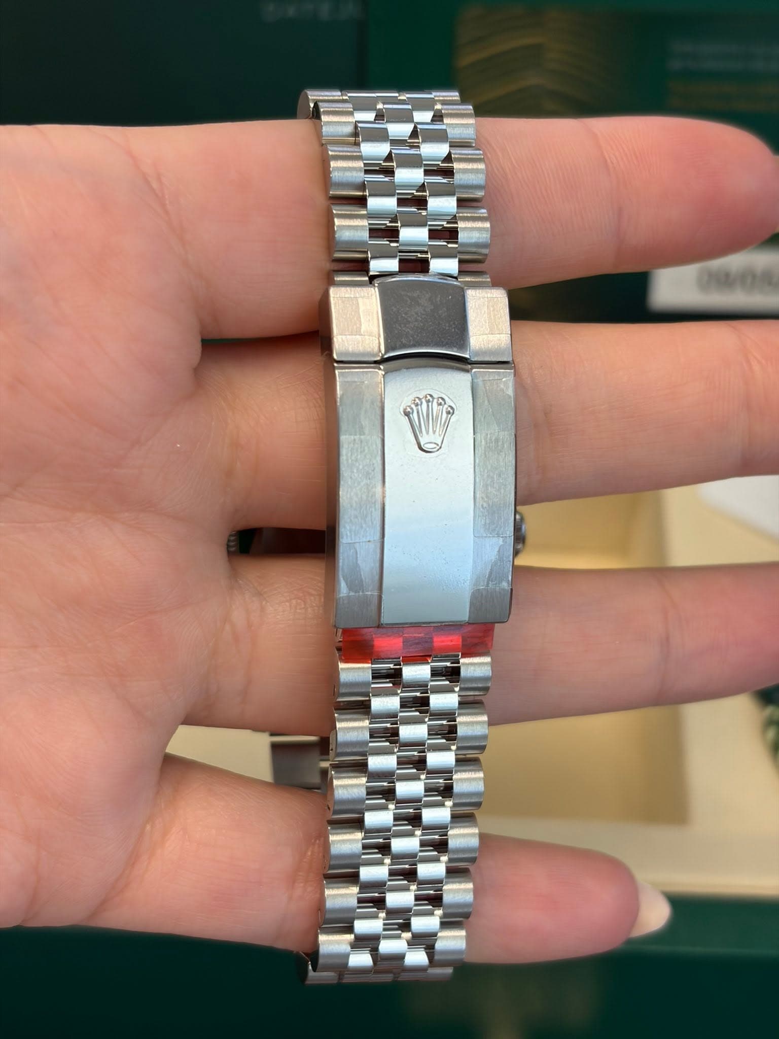May be an image of wrist watch and text