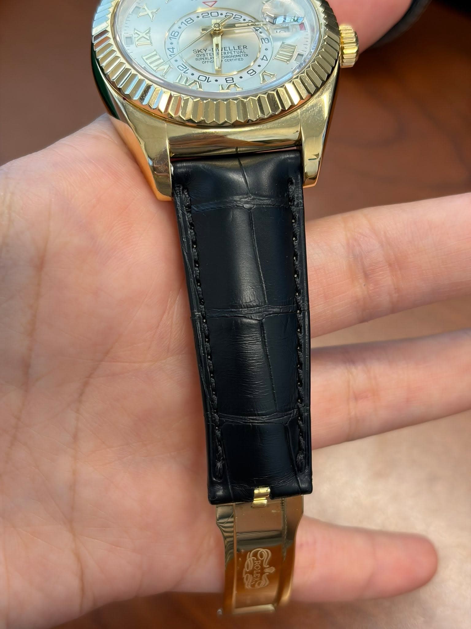 May be an image of wrist watch and text
