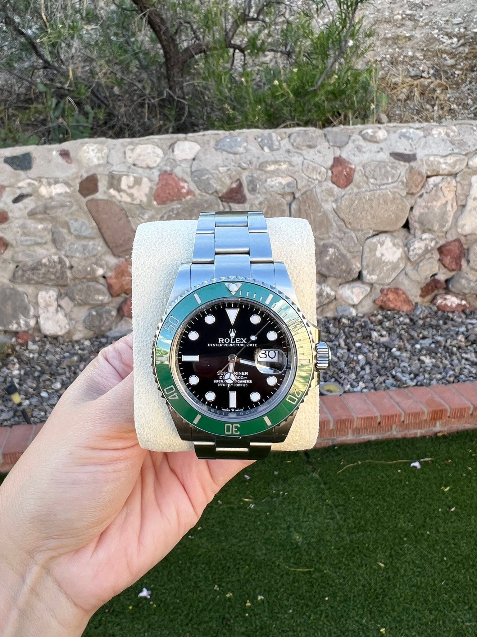 May be an image of wrist watch and text