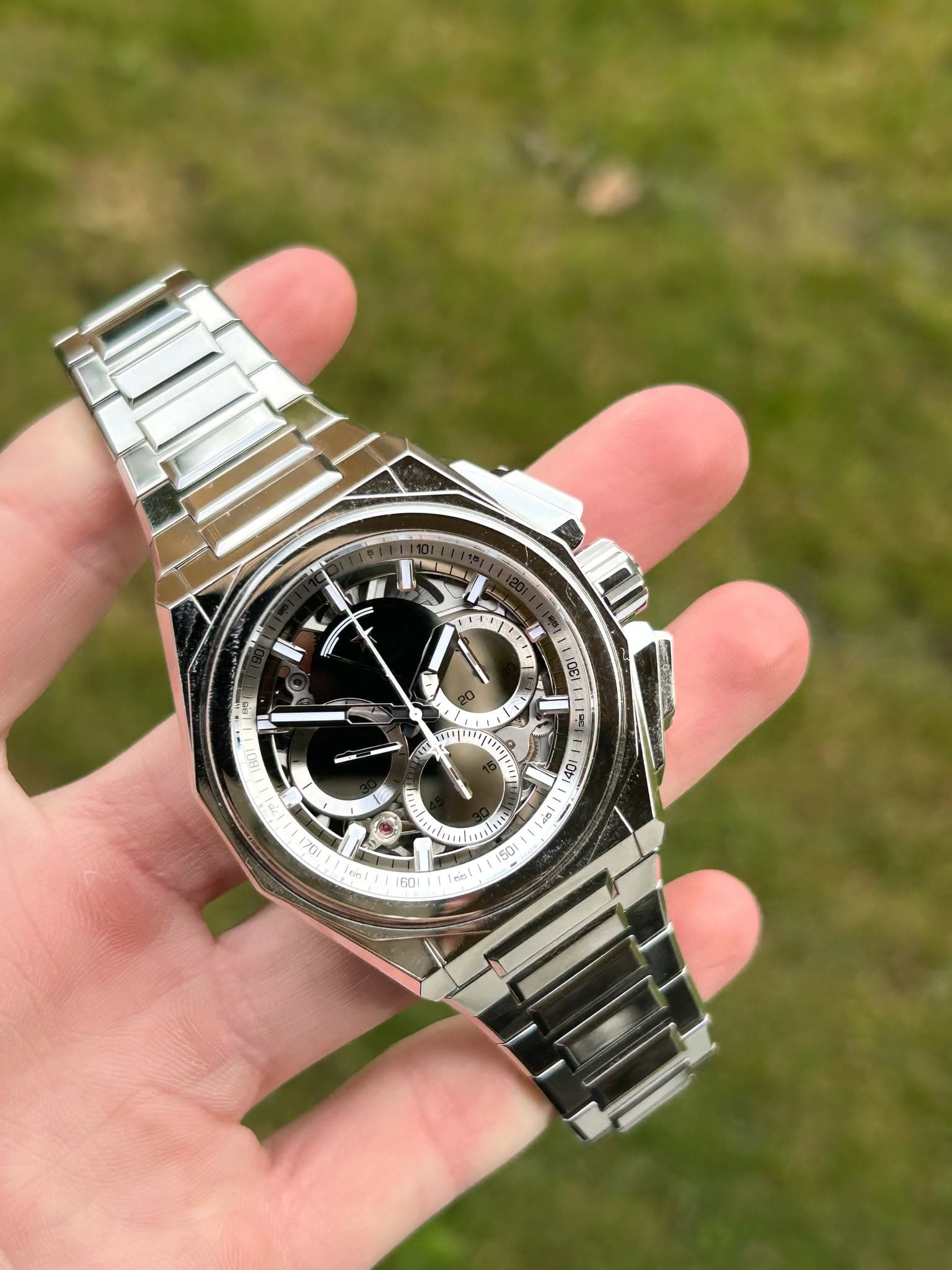 May be an image of wrist watch and text