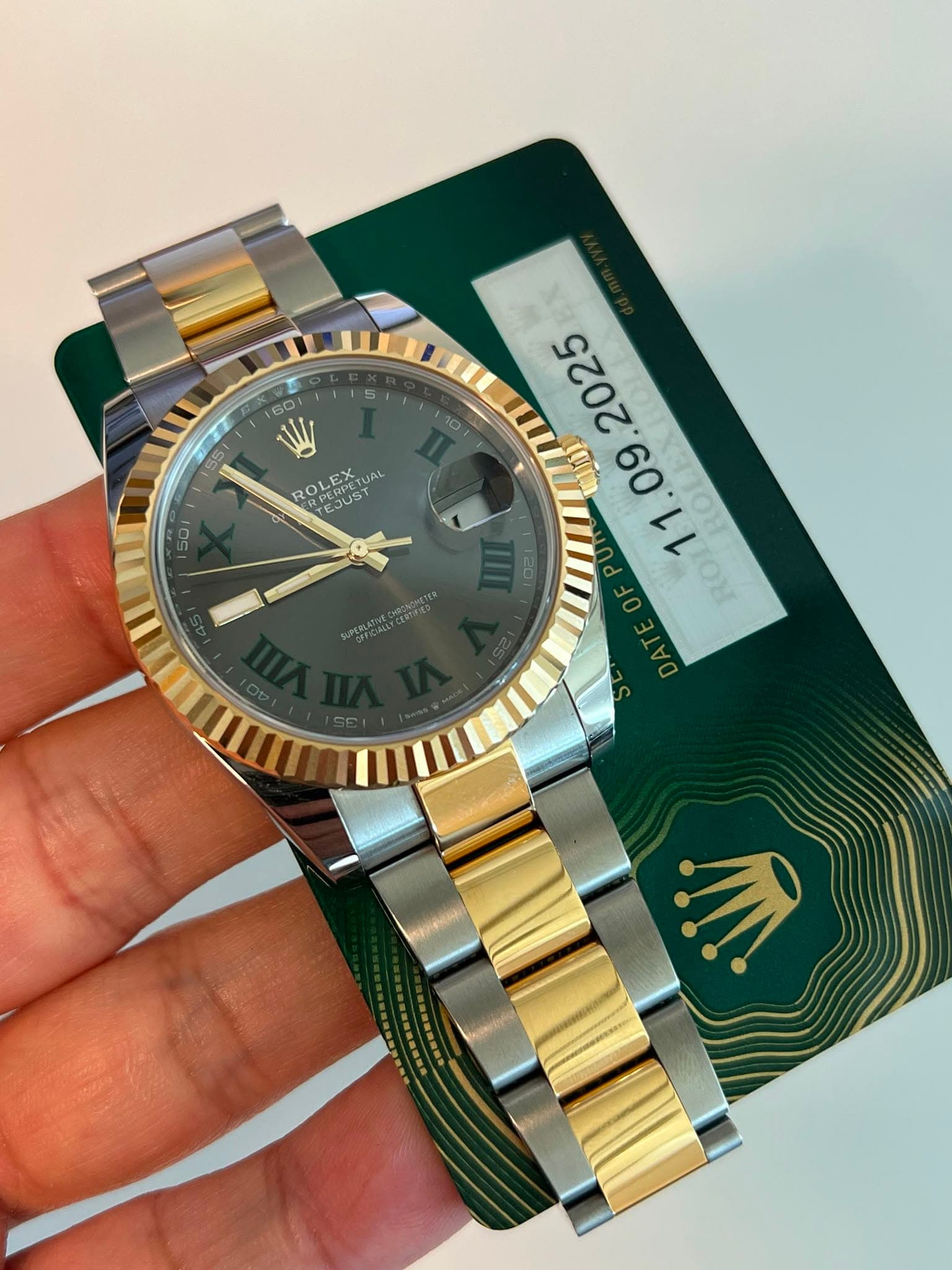 May be an image of wrist watch and text