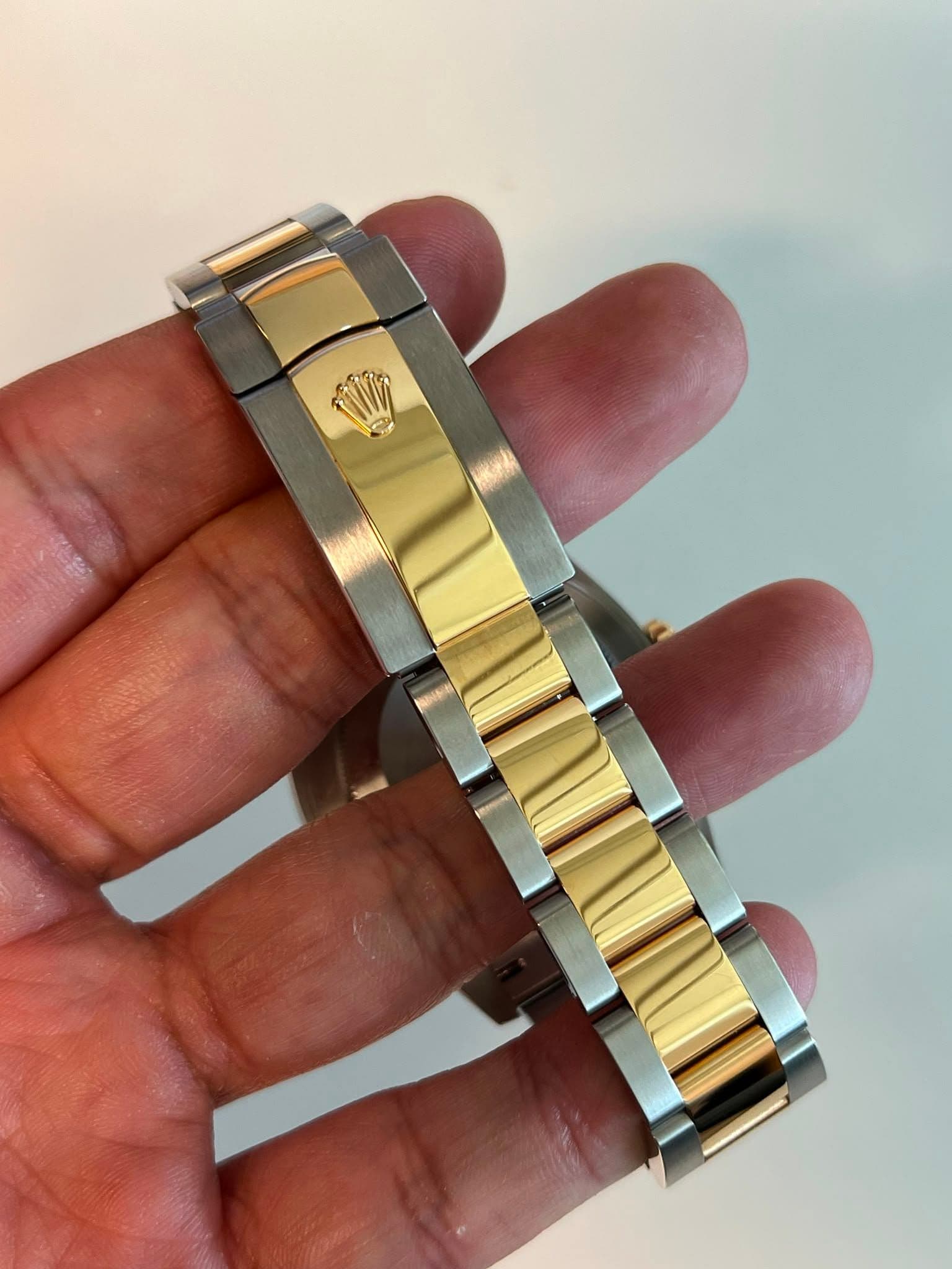 May be an image of wrist watch and text