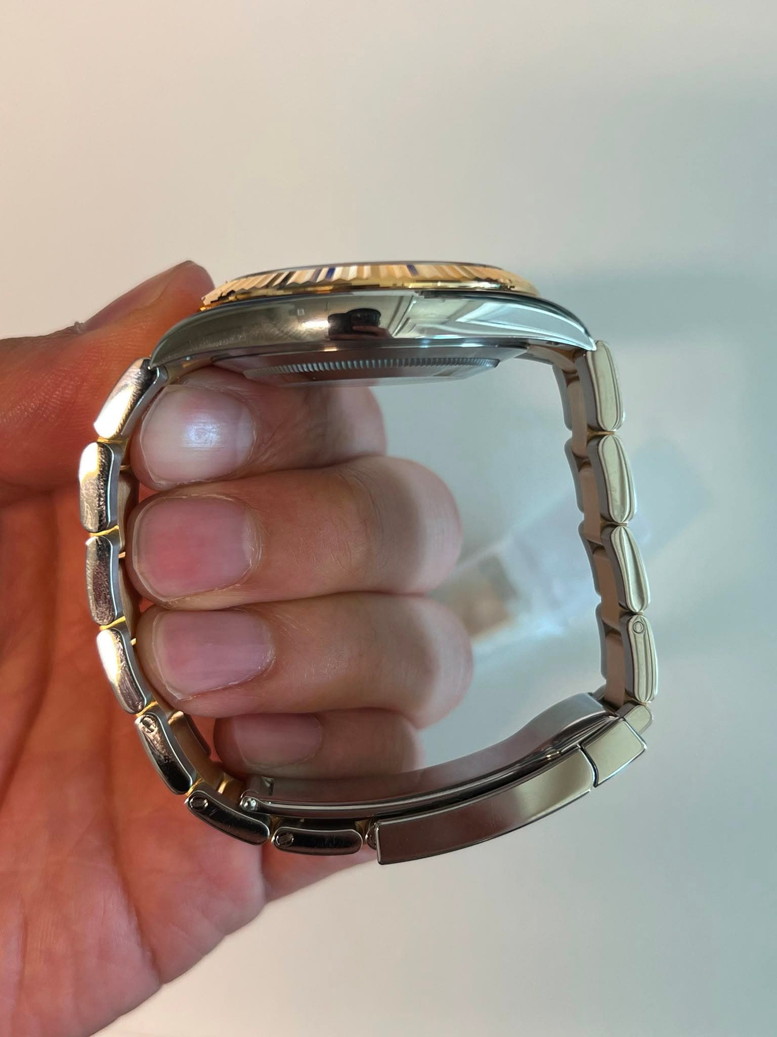 May be an image of wrist watch and jewelry