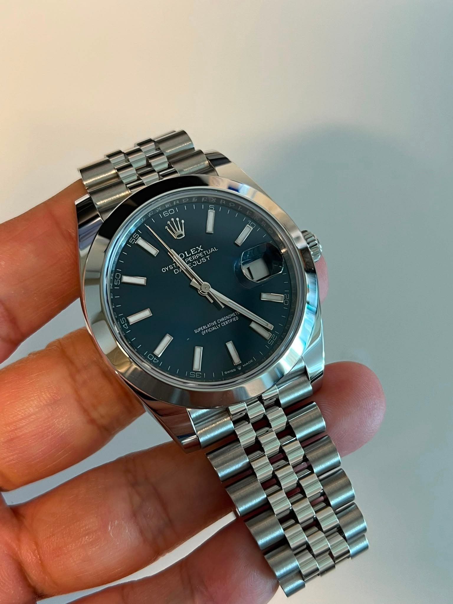 May be an image of wrist watch and text
