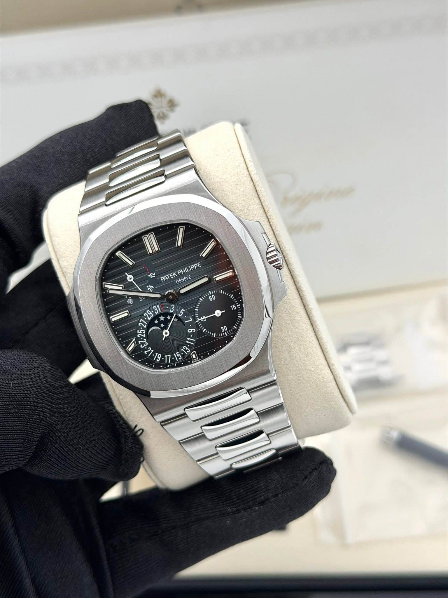 May be an image of wrist watch and text that says 'PATEK PHIL PHI IPPE GENEVE ናት 5 ن 15 3 U $7-25-27 ١ 27 نا 9 L من'