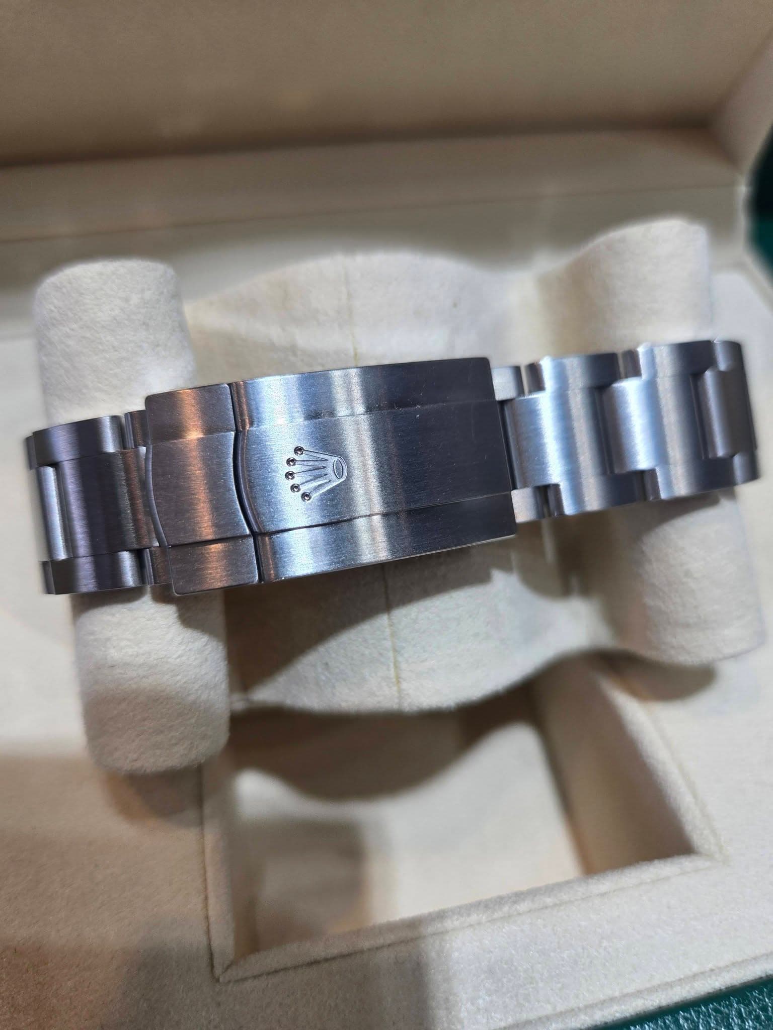 May be an image of wrist watch and text