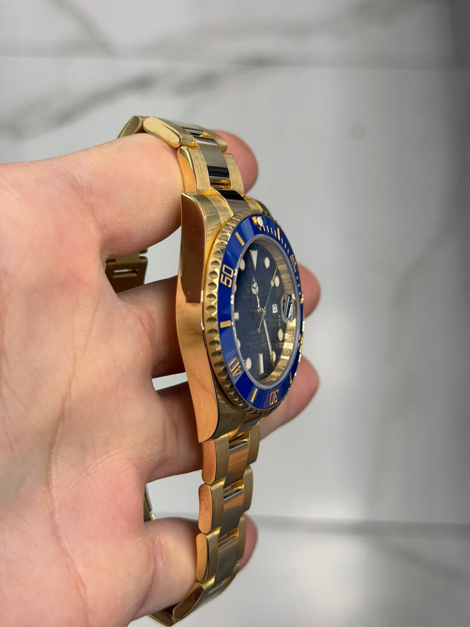 May be an image of wrist watch and text