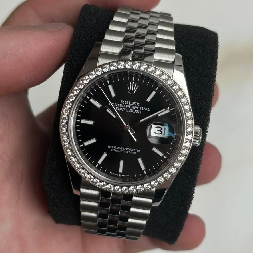 May be an image of wrist watch and text