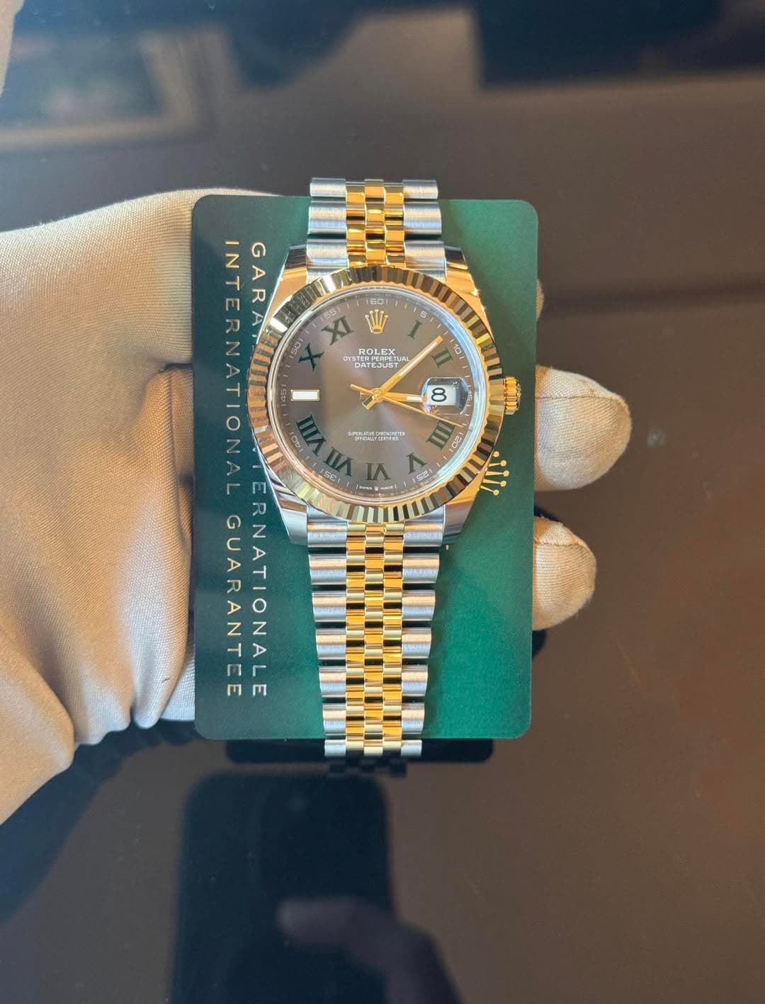 May be an image of wrist watch and text